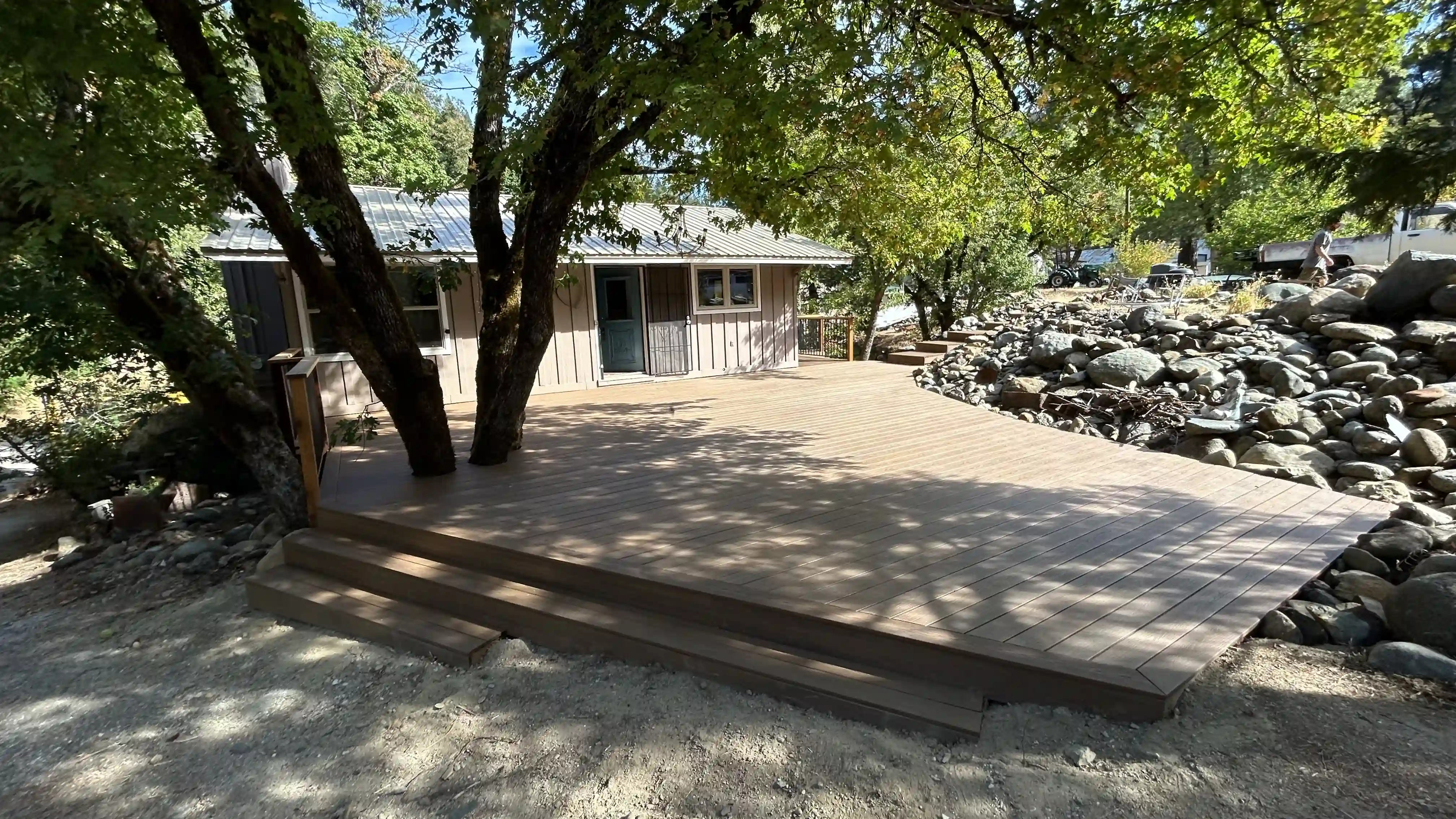 Ground-level deck abrove rocks.